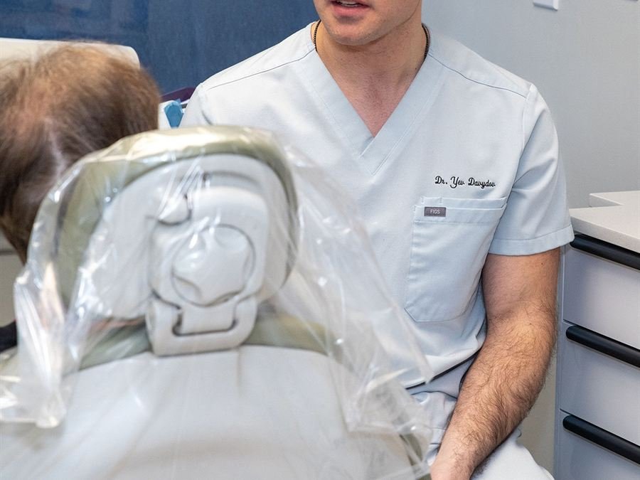 Dentist discussing orthodontic options with a patient at Chroma Dental